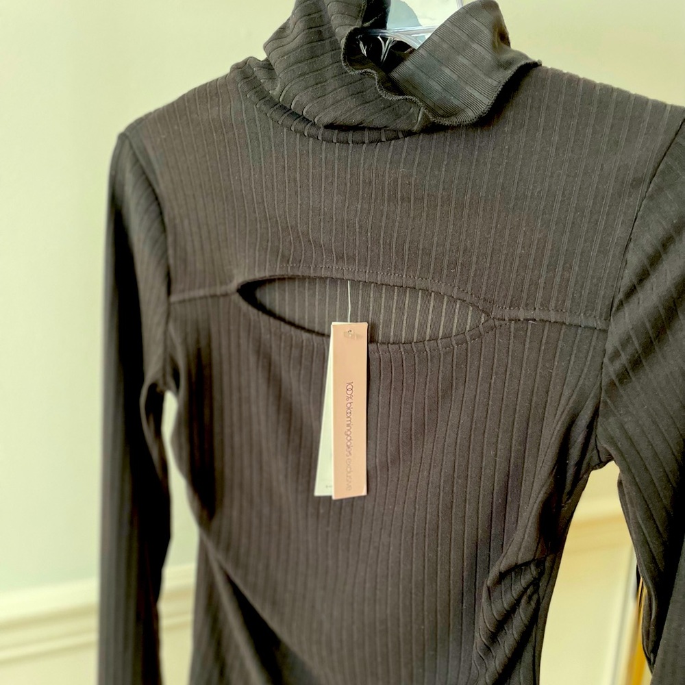 Black tissue turtleneck by Aqua. Oval cutout above the breast, size small. New